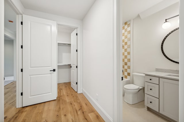 full bathroom featuring vanity, separate shower and tub, wood-type flooring, and toilet