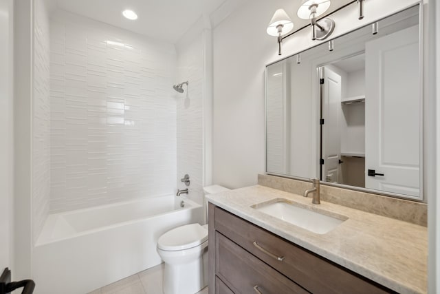 full bathroom featuring vanity, toilet, tile patterned floors, and tiled shower / bath