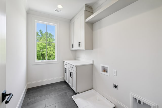 laundry area featuring electric dryer hookup, cabinets, and hookup for a washing machine