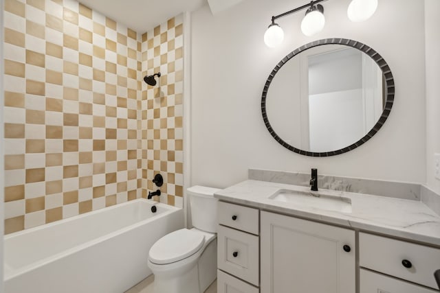 full bathroom featuring vanity, tiled shower / bath combo, and toilet