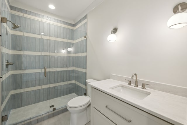 bathroom with a shower with door, toilet, tile patterned floors, and vanity