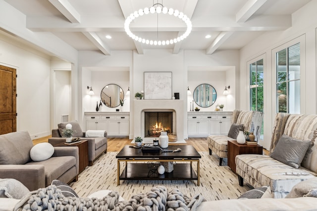 living room with beam ceiling and light hardwood / wood-style flooring