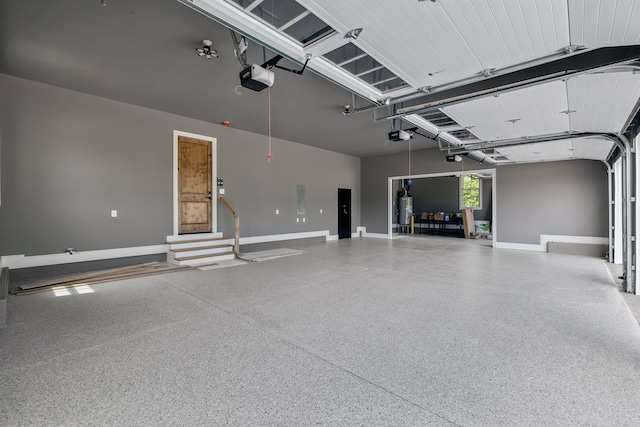 garage featuring a garage door opener and water heater