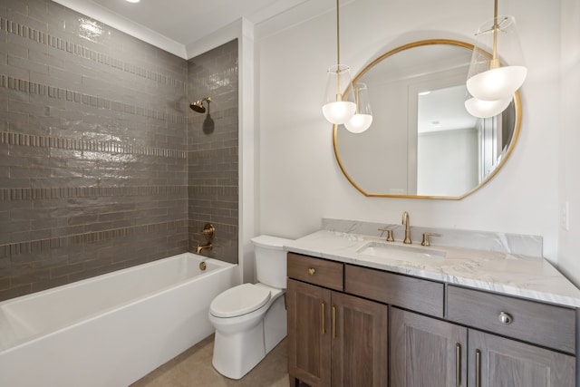 full bathroom featuring tiled shower / bath, vanity, and toilet