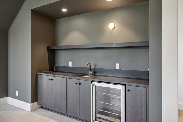 bar featuring wine cooler and sink