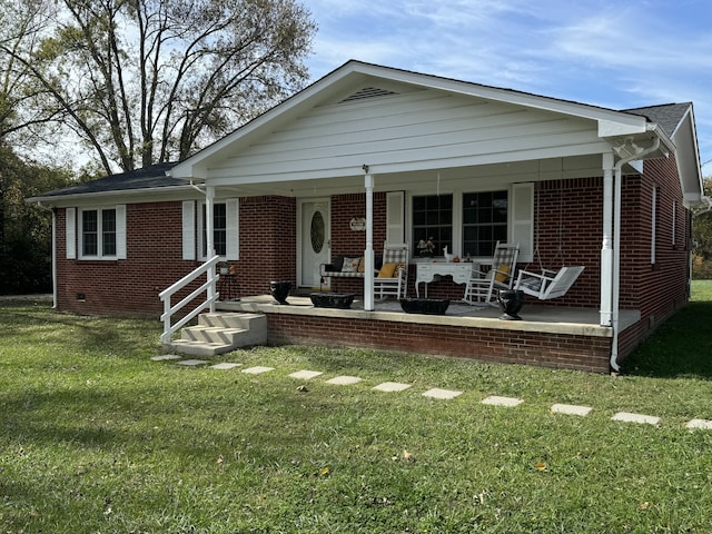 view of front of home featuring a porch and a front lawn