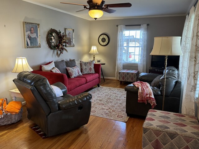 living room featuring crown molding, ceiling fan, and hardwood / wood-style floors