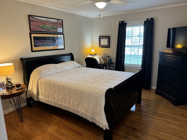 bedroom with ceiling fan, ornamental molding, and dark hardwood / wood-style floors