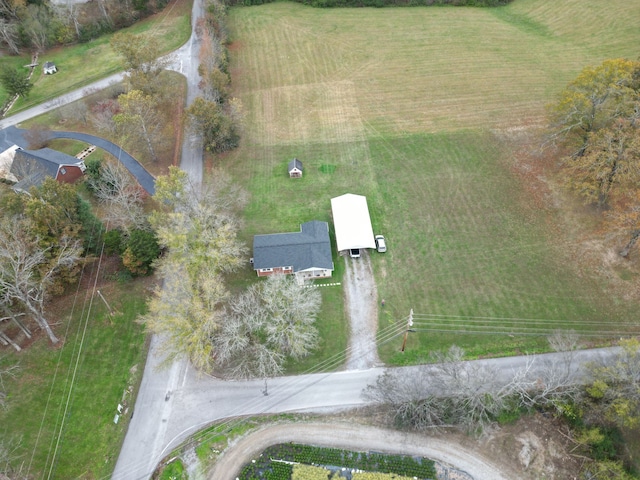 birds eye view of property with a rural view