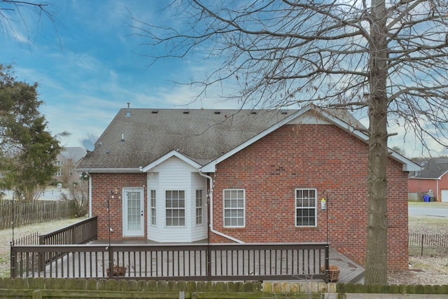 rear view of house with a wooden deck