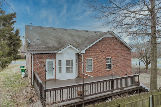 rear view of house with a wooden deck