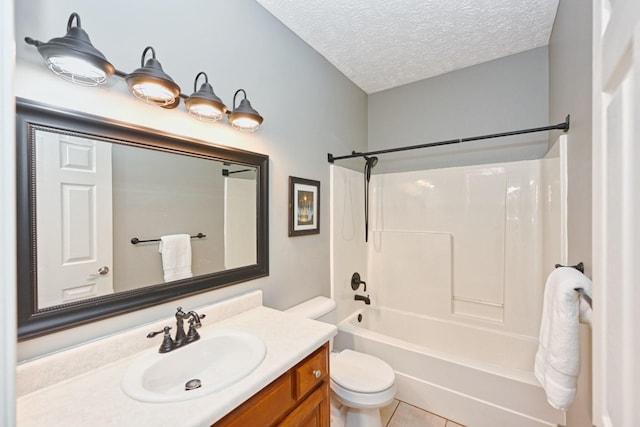 full bathroom featuring washtub / shower combination, vanity, a textured ceiling, tile patterned floors, and toilet