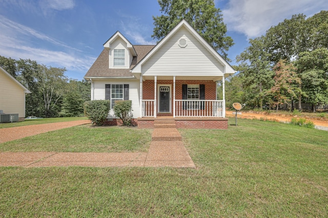 view of front of property with central air condition unit, a front yard, and a porch