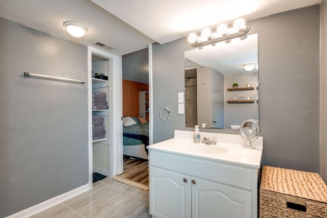 bathroom with vanity and hardwood / wood-style flooring