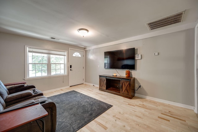 living room with light hardwood / wood-style flooring