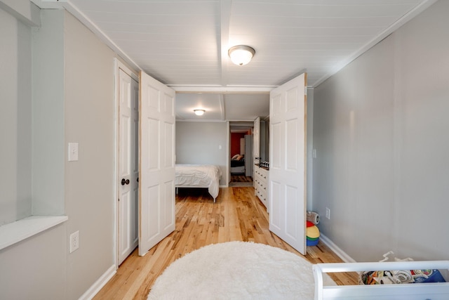 bedroom featuring light hardwood / wood-style floors and ornamental molding