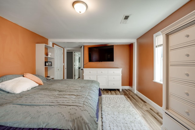 bedroom with light wood-type flooring