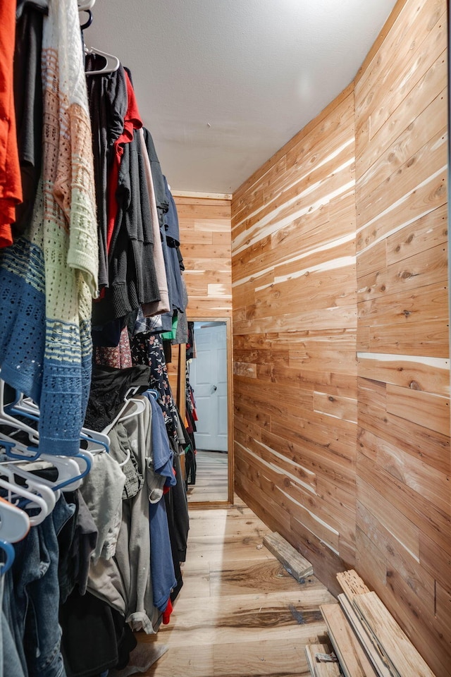 spacious closet featuring hardwood / wood-style flooring