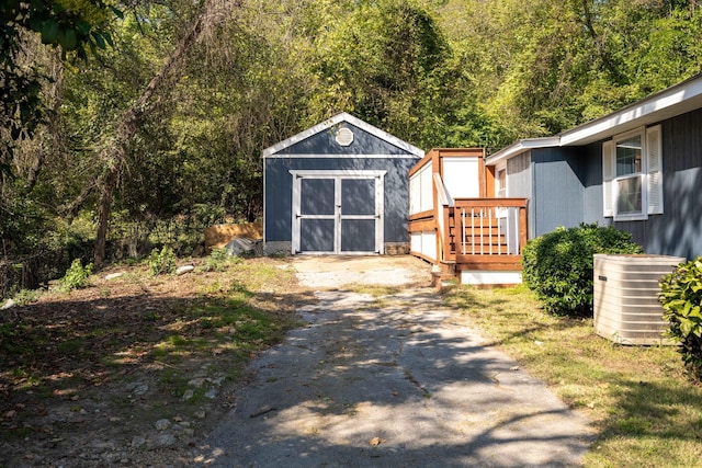 view of outbuilding with central air condition unit