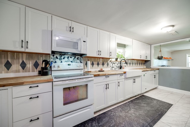 kitchen with wooden counters, sink, white cabinets, white appliances, and tasteful backsplash