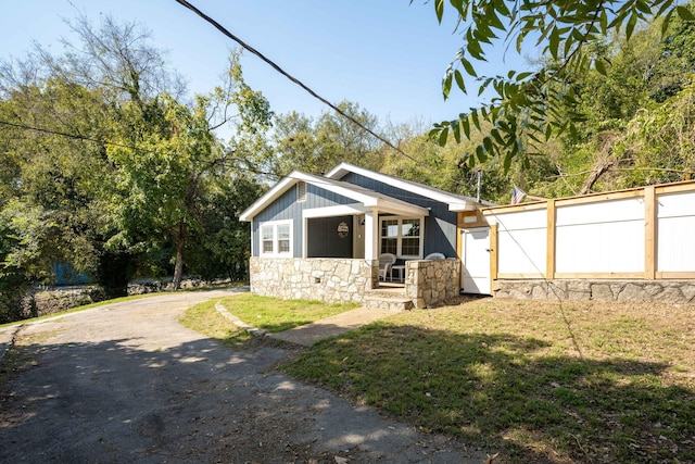 view of side of property with a lawn