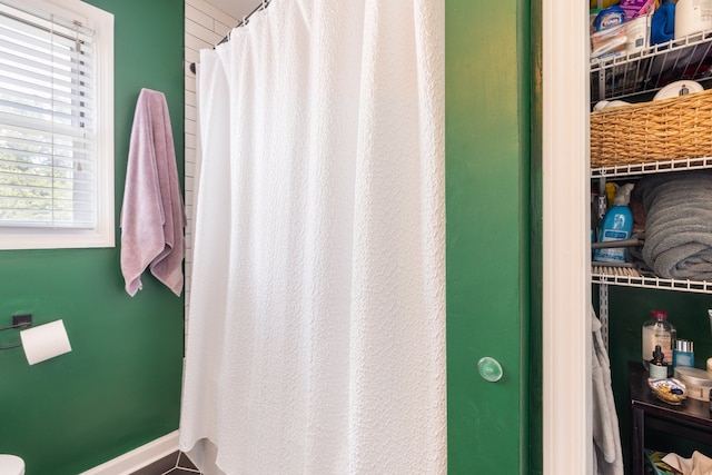 bathroom with a shower with shower curtain