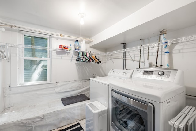 laundry room featuring washing machine and clothes dryer