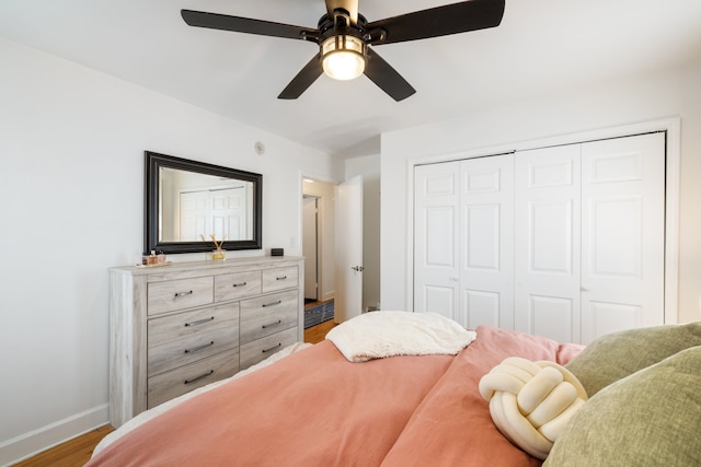 bedroom featuring a closet, ceiling fan, and hardwood / wood-style flooring