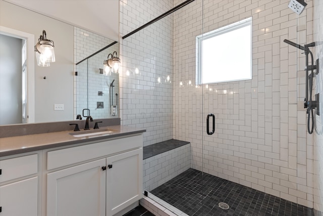 bathroom featuring vanity and walk in shower