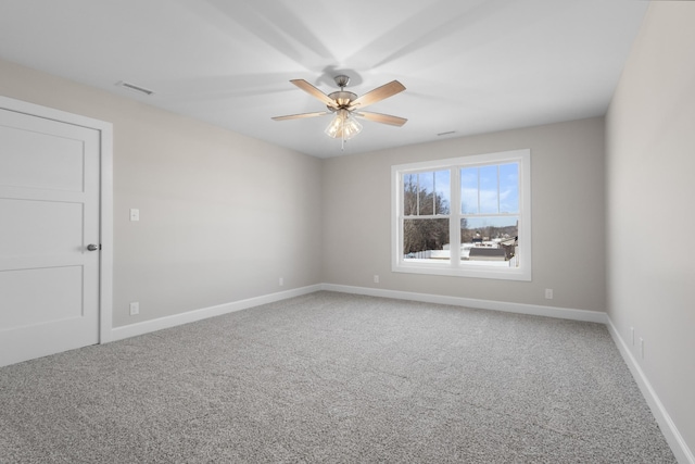 carpeted empty room with ceiling fan