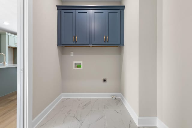 clothes washing area with cabinets, washer hookup, hookup for an electric dryer, and sink