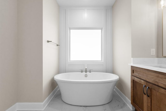 bathroom featuring vanity and a tub to relax in