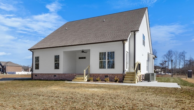 back of house with cooling unit, ceiling fan, a yard, and a patio