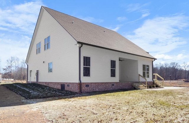 view of side of home featuring a yard