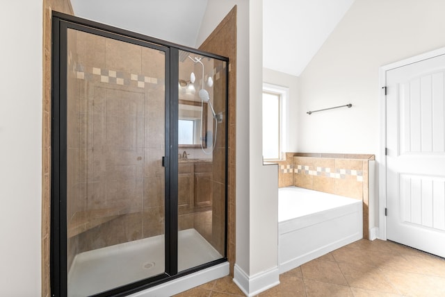 bathroom with independent shower and bath, tile patterned floors, and vaulted ceiling