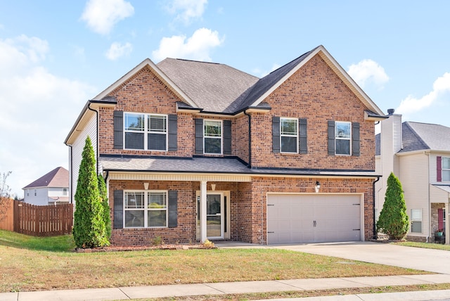 view of front of home with a garage and a front yard