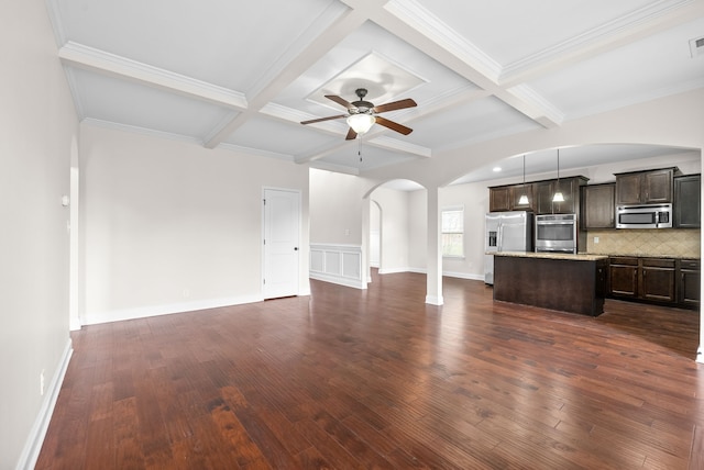 unfurnished living room with dark wood-type flooring, coffered ceiling, ceiling fan, and crown molding