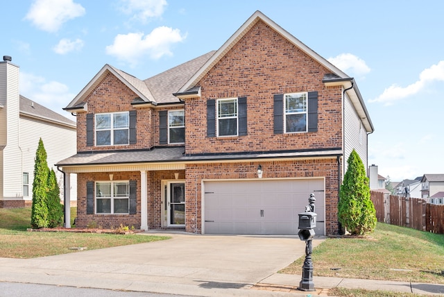 view of front facade featuring a front lawn and a garage