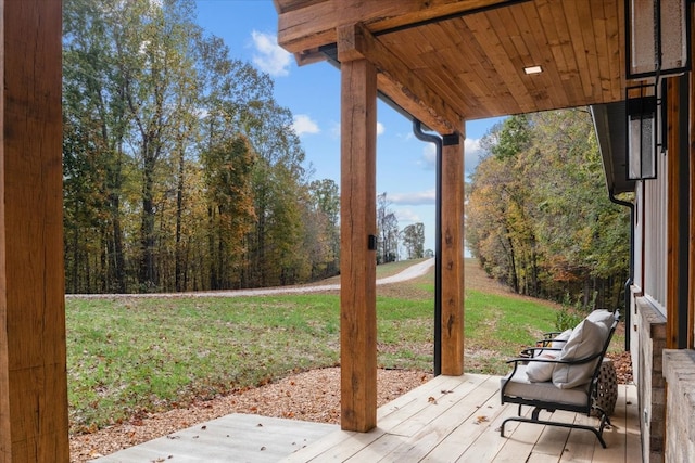 wooden deck with a yard