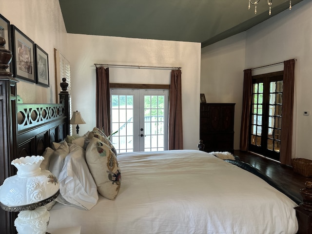 bedroom featuring french doors, hardwood / wood-style flooring, and access to exterior