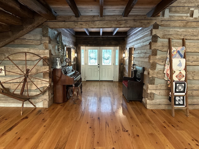 entryway featuring light hardwood / wood-style floors, french doors, and beamed ceiling