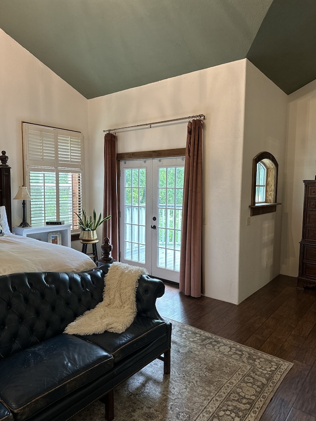 bedroom featuring lofted ceiling, french doors, access to outside, and dark hardwood / wood-style flooring