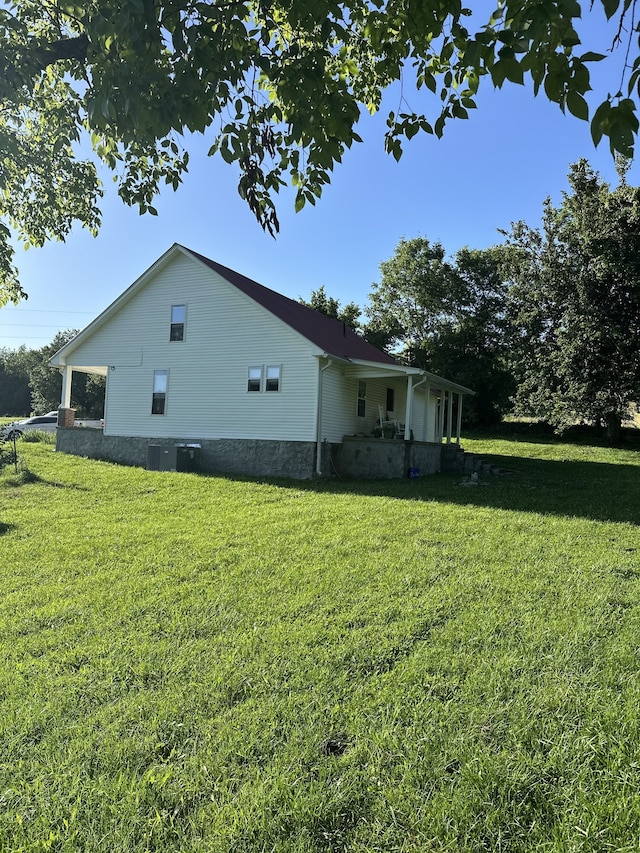 view of property exterior with a yard