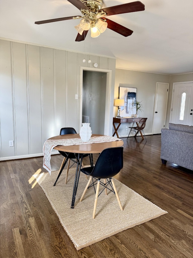 dining room featuring ceiling fan, plenty of natural light, and dark hardwood / wood-style floors