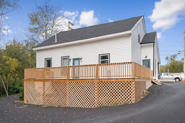 view of side of property featuring a deck