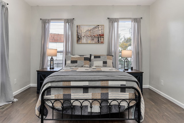 bedroom with dark wood-type flooring