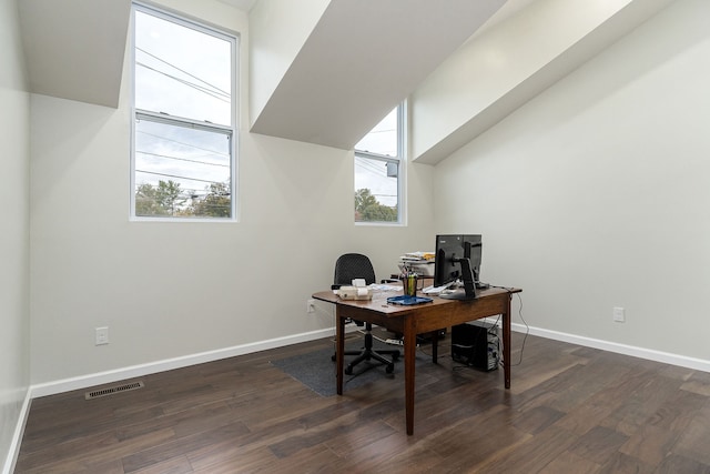 home office with dark hardwood / wood-style floors