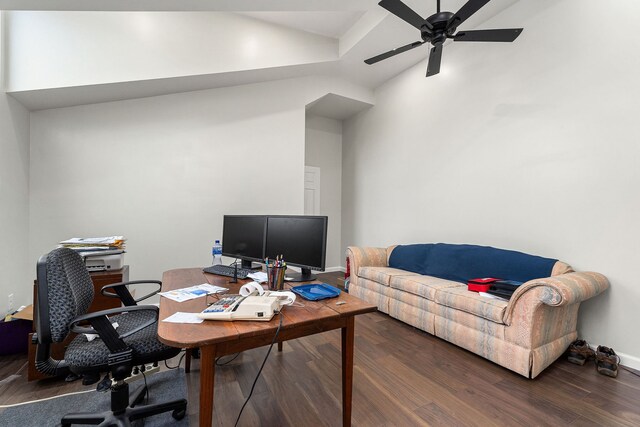 office space featuring ceiling fan, lofted ceiling, and dark hardwood / wood-style flooring