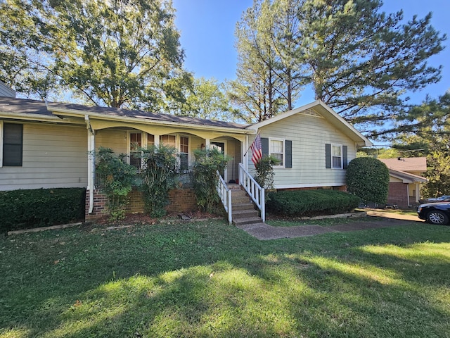 view of front of property with a porch and a front lawn