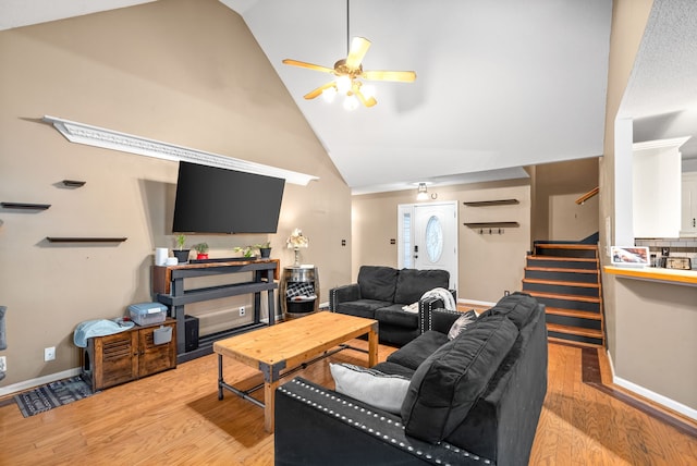 living room with light hardwood / wood-style flooring, high vaulted ceiling, and ceiling fan